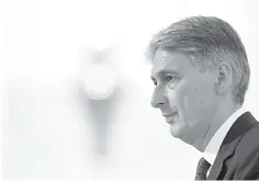  ??  ?? Britain’s Chancellor of the Exchequer Philip Hammond delivers his re-scheduled speech to the Bankers and Merchants of the City of London, during a breakfast event at The Mansion House in London on June 20. — AFP photo