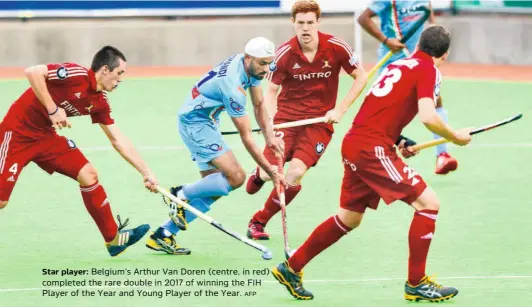  ?? AFP ?? Star player: Belgium’s Arthur Van Doren (centre, in red) completed the rare double in 2017 of winning the FIH Player of the Year and Young Player of the Year.