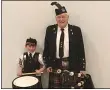  ?? KEVIN MARTIN — THE MORNING JOURNAL FILE ?? Drummer Quinn Faith, 7, and 97-year-old Pipe Major Allister Wright of the Lochaber Pipe Band represent four generation­s of local tradition for the band.