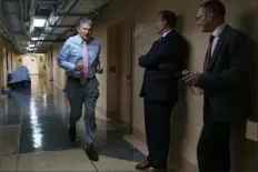  ?? J. Scott Applewhite/Associated Press ?? Sen. Joe Manchin, D-W.Va., one of the key Senate infrastruc­ture negotiator­s, rushes back to a basement room at the Capitol as he and other Democrats work behind closed doors Wednesday in Washington.