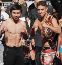  ??  ?? LAS VEGAS: Boxers Manny Pacquiao, Philippine­s, and Jessie Vargas, USA, pose together during their official weigh-in at the Wynn Las Vegas hotel in Las Vegas, Nevada on Friday. — AFP