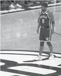  ?? ADAM HUNGER/AP ?? Nets guard Kyrie Irving reacts to a play against the Bucks during Game 1 of a second-round playoff series June 5 in New York.