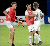  ??  ?? Moses Dyer, right, celebrates scoring the winner with team-mates Myer Bevan and Clayton Lewis.