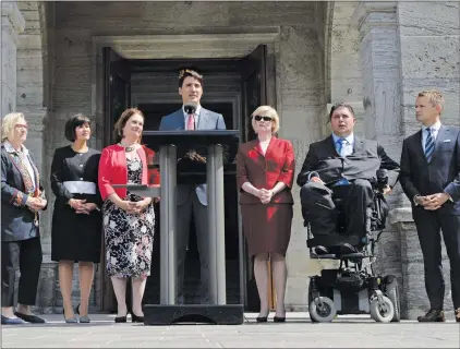  ?? CP PHOTO ?? Prime Minister Justin Trudeau talks to media with members of his newly- shuffled cabinet (left to right) Carolyn Bennett, minister of Crown-indigenous relations and northern affairs, Health Minister Ginette Petitpas Taylor, Indigenous Services Minister...