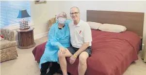  ?? AP ?? Mary Daniel and her husband, Steve, sit together in his room at a Jacksonvil­le memory care center. Daniel took a part-time job washing dishes at the facility to see him.