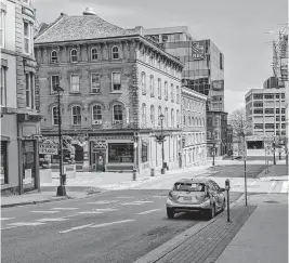  ?? JOHN MCPHEE • THE CHRONICLE HERALD ?? An eerily quiet downtown Halifax is seen on a recent weekend. Experts say crimes related to busy bars or other public gatherings will naturally go down during a pandemic.