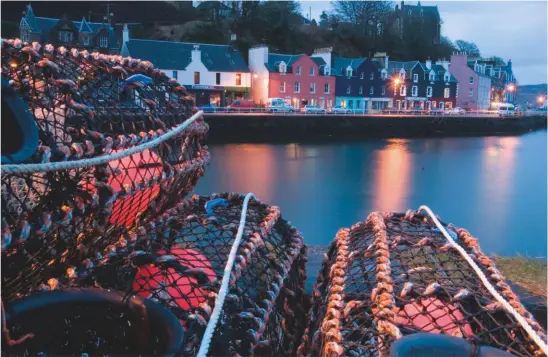  ??  ?? Crab pots on Tobermory Harbour at dusk, Isle of Mull, Argyll – Scottish boats accounted for just under 14,000 tonnes of crab in 2016