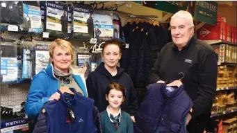  ??  ?? Niamh Clifford Beaufort, Amy and Marie O’Sullivan Callinafer­cy looking at the wide range of Portwest Clothing with Joe Walsh at Kerry Agribusine­ss. Killorglin.