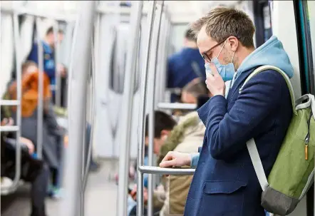  ?? AFP ?? When wearing face mask, do cough or sneeze into your elbow, but avoid touching your mask as much as possible. —