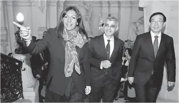  ??  ?? Sadiq (centre), Hidalgo (left) and Park arrive to attend a meeting on air pollution in Paris, France. — Reuters photo