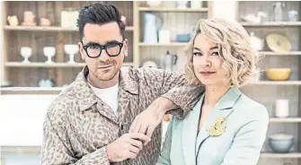  ?? THE CANADIAN PRESS ?? Dan Levy and Julia Chan are the co-hosts of The Great Canadian Baking Show, which premiered Wednesday on CBC.