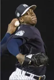  ?? MATT ROURKE — THE ASSOCIATED PRESS FILE ?? In this March 2 photo, New York Yankees closer Aroldis Chapman during a spring training baseball game against the Baltimore Orioles in Tampa, Fla. Chapman returned to the New York Yankees for a record-breaking deal.