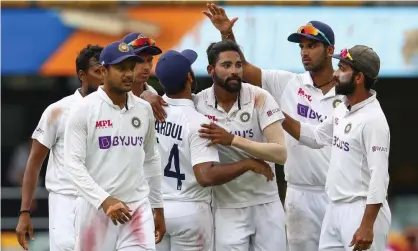  ?? Photograph: Tertius Pickard/AP ?? India’s Mohammed Siraj (third right) took five wickets in Australia’s second innings on day four of the fourth Test at the Gabba.