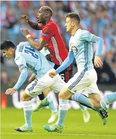  ?? Pictures: PA. ?? Top: the ball nestles in the back of Celta Vigo’s net as Marcus Rashford fires home a spendid free-kick; above: Paul Pogba is crowded out by Celta opponents.