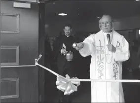  ?? NEWS-SENTINEL FILE PHOTOGRAPH ?? Bishop Stephen Blaire blesses the plaza during the grand opening and blessing of St. Anne's Catholic Church Community Plaza on March 11 in Lodi.