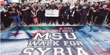  ??  ?? YAYASAN MSU mengumpul RM20,000 untuk disumbangk­an kepada mangsa peperangan di Syria.