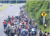  ?? ZUMA PRESS ?? Migrants from Honduras march in a caravan toward the Mexican border on Oct. 18. This photo was taken in Guatemala City.