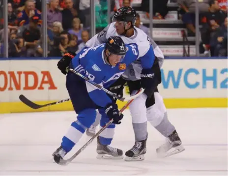  ?? BRUCE BENNETT/GETTY IMAGES ?? Patrik Laine, playing for Finland, and Auston Matthews of Team North America went head to head at the World Cup of Hockey last month.