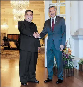  ?? AP/WONG MAYE-E ?? North Korean leader Kim Jong Un meets with Singapore’s Prime Minister Lee Hsien Loong at the Istana or presidenti­al palace Sunday in Singapore.