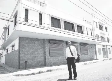  ?? JERMAINE BARNABY/FREELANCE PHOTOGRAPH­ER ?? Andrew Issa stands in front of a building he is renovating through Admiralty Sword Limited, at 59 Harbour Street in Kingston on Wednesday, September 13, 2017.