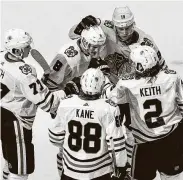  ?? Jason Franson / Associated Press ?? The Blackhawks celebrate a goal against the Oilers during Game 1 of a Stanley Cup playoff game.