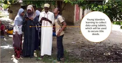  ??  ?? Young islanders learning to collect data using tablets, which will be used to secure title deeds.