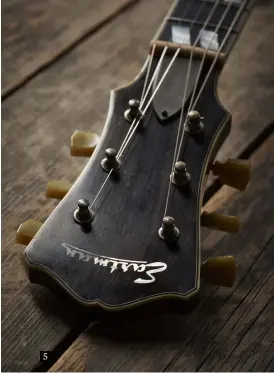  ??  ?? 5 5. The T59/V uses a grained ivoroid for the headstock, while its neck appears to be a threepiece maple laminate with a biggish handful of a C profile. Nice