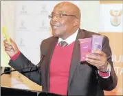  ?? PICTURE MARILYN BERNAD ?? Minister of Health Aaron Motsoaledi reveals the new condom known as Max at the Youth Dialogue on HIV/Aids held at the Hilton Hotel on Thursday.