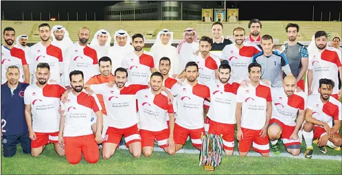  ??  ?? Boubyan Bank football team pose for a group photo after finishing as runners-up in the Bank Football League.