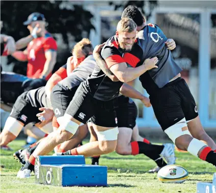  ??  ?? Collision course: Brad Shields (left) tackles Billy Vunipola as England prepare for a physical series against South Africa