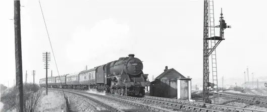  ?? W A C Smith/Transport Treasury ?? A 1947 product of Horwich Works, Dalry Road-allocated Stanier ‘Black Five’ class 4-6-0 No 44994 heads the 10.15am Stirling-Edinburgh
(Princes Street) service along ‘Caley’ metals through Dalry Middle Junction on 29 February 1964, so it will soon pass through Dalry Road station. Having left the Edinburgh & Glasgow main line at Haymarket West Junction, it is now meeting the Caledonian’s east-facing spur from Granton and Leith, the line curving in from the right, and is less than a mile from terminatio­n.