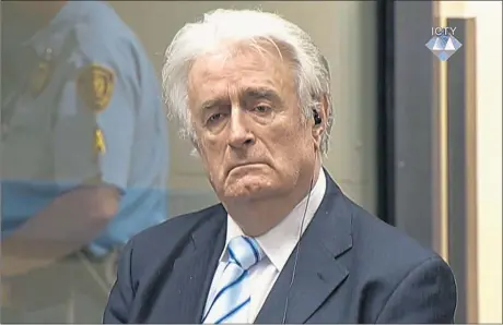  ??  ?? Bosnian Serb wartime leader Radovan Karadzic listens to the verdict at the Internatio­nal Criminal Tribunal for Former Yugoslavia