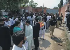  ?? AP ?? Supporters of Pakistan’s former prime minister, Nawaz Sharif, gather outside Adiala jail in Rawalpindi on Thursday