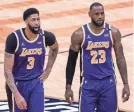  ?? DERICK HINGLE/AP ?? Anthony Davis (3) and LeBron James’ health will help determine the Lakers’ 2021-22 fate.