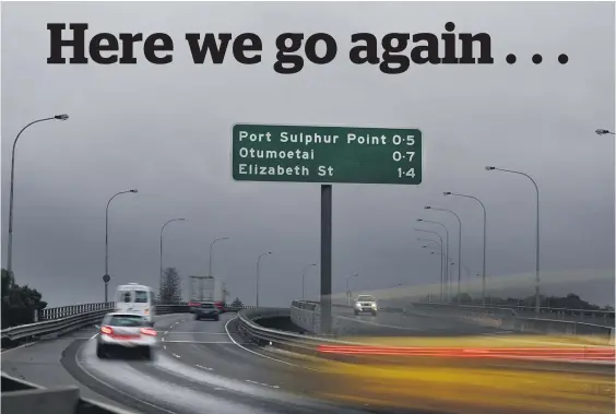  ?? Picture / NZME ?? Storm clouds surround traffic on the Tauranga Harbour Bridge yesterday.