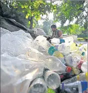  ?? FILE PHOTO ?? A scrap vendor sorts plastic bottles in New Delhi.