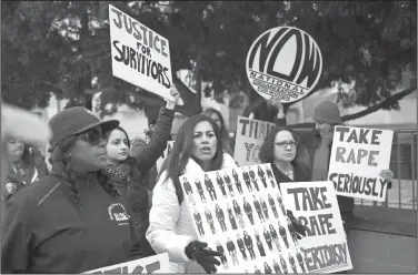  ?? Corey Perrine/AP ?? Protest: Sonia Ossorio, center, president of the National Organizati­on for Women of New York, leads a group in protest, after Bill Cosby arrives for his sexual assault trial at the Montgomery County Courthouse on Monday.