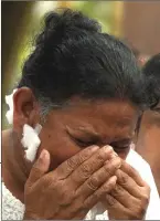  ??  ?? A relative mourns at a burial ceremony for a victim of the bomb blast. — Acm photo