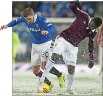  ??  ?? ICE-COOL: Kyle Hutton (left) kept his place ahead of Ian Black for Friday’s battle in the Ibrox snow