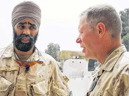  ?? POSTMEDIA NEWS • FILE ?? Brig.-Gen. Jon Vance, right, who went on to become Canada’s Chief of Defence Staff before recently being accused of sexual misconduct, is seen with Lt.-Col. Harjit Sajjan, who is now Canada’s defence minister, in Kandahar City, Afghanista­n, in 2008.