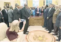  ?? — AFP ?? Counselor to the President Kellyanne Conway takes a photo as US President Donald Trump receives leaders of historical­ly black universiti­es and colleges in the Oval Office of the White House.
