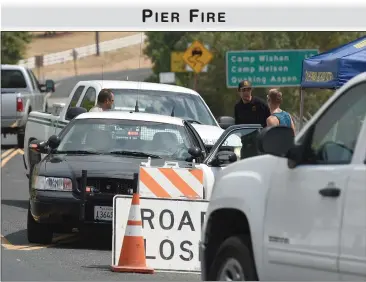  ?? RECORDER PHOTO BY CHIEKO HARA ?? Highway 190 has been closed due to the Pier Fire north of Springvill­e. Early Friday a voluntary evacuation was issued for Springvill­e as the fire burned toward the small town Thursday night.