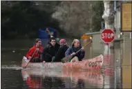  ?? KARL MONDON— BAY AREA NEWS GROUP ?? Guernevill­e residents paddle through the flooded streets of their Russian River town on Feb. 27, 2019.