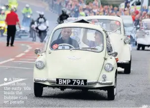  ?? A little Isetta from the early ’60s leads the bubble cars on parade ??