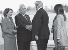  ?? AP PHOTO BY PABLO MARTINEZ MONSIVAIS ?? U.S. President Donald Trump and first lady Melania Trump are greeted by Frank Pence, second from the left, U.S. Ambassador to Finland and his wife, Suzy Pence, far left, on the tarmac upon their arrival Sunday at the airport in Helsinki, Finland.