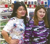  ??  ?? SM De pa r tme nt Stor e division merchandis­e manager Shirley Herrera and ELRO Retail Corp. marketing head Cecille Loretizo.