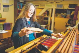  ??  ?? Arbutus Folk School holds courses on ceramics, woodworkin­g and weaving, among other crafts. Weaving Instructor Marjorie Erickson demonstrat­es her craft.