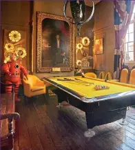  ??  ?? Items for sale in the games room include the pool table, estimate £800-£1,200; iron hanging lantern, £4,000-£6,000; Tintin model, £3,000-5,000; yellow leather tub chairs, £400-£600
Kate Moss print with hand-applied Swarovski crystals by artist Chris Levine, estimate £30,000-£35,000