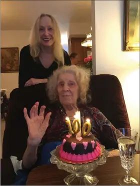  ?? PEG DEGRASSA - MEDIANEWS GROUP ?? Anna Pikes, front, gets ready to blow out the candles on her 100th birthday cake, while daughter Anna Marie Marshall of Kiawah Island, Sounth Carolina stands behind her at the celebratio­n.