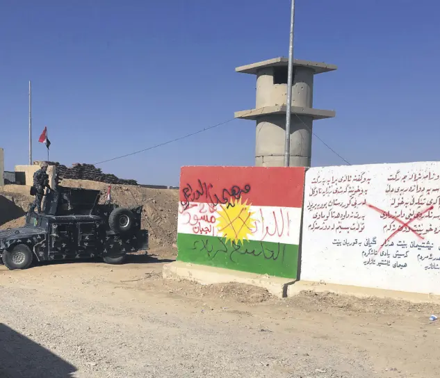  ??  ?? Iraqi troops near the oil fields in Kirkuk, Iraq, Oct.16.